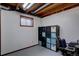 Finished basement with a window, storage unit, and open ceiling at 1549 S Evanston St, Aurora, CO 80012