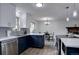 Stylish kitchen featuring navy-blue cabinets, stainless steel appliances, and a modern design at 1549 S Evanston St, Aurora, CO 80012