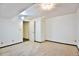 Carpeted room featuring white walls and drop ceiling lighting in the basement at 1641 S Idalia Cir # F, Aurora, CO 80017