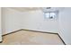 Unfurnished basement room featuring carpet and a single small window at 1641 S Idalia Cir # F, Aurora, CO 80017