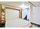 Unfinished basement showcasing a Murphy bed frame with space for a cozy sleeping or storage area at 1641 S Idalia Cir # F, Aurora, CO 80017