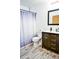 Bathroom featuring a wood-style floor and a vanity with black hardware at 1641 S Idalia Cir # F, Aurora, CO 80017