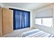 Bedroom with window, double bed, and blue curtains at 1641 S Idalia Cir # F, Aurora, CO 80017