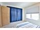 Bedroom showcasing a window with blinds, drapes, and light gray carpet at 1641 S Idalia Cir # F, Aurora, CO 80017