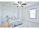 Bright bedroom with ceiling fan, window, and neutral carpeting at 1641 S Idalia Cir # F, Aurora, CO 80017