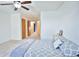 Bedroom with view to hallway, ceiling fan, and neutral carpeting at 1641 S Idalia Cir # F, Aurora, CO 80017