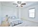 Bright bedroom with ceiling fan and gray bedding at 1641 S Idalia Cir # F, Aurora, CO 80017