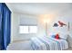 Bright bedroom with a double bed and dinosaur theme at 1641 S Idalia Cir # F, Aurora, CO 80017