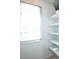 White shelves and a window fill this bright pantry at 1641 S Idalia Cir # F, Aurora, CO 80017