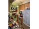 Galley kitchen with stainless steel sink, light wood cabinets, and appliances at 1888 S Jackson St # 404, Denver, CO 80210