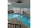 Indoor pool with tile floors and ladders for access at 1888 S Jackson St # 404, Denver, CO 80210