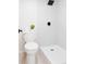 Bathroom featuring a toilet, walk-in shower with a niche, and a sleek, minimalist design at 7395 E Eastman Ave # 202N, Denver, CO 80231