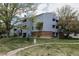 Exterior shot of a building with several balconies and a well maintained green lawn at 7395 E Eastman Ave # 202N, Denver, CO 80231