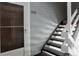 Apartment 202 exterior staircase leading to front door, showcasing neutral siding at 7395 E Eastman Ave # 202N, Denver, CO 80231