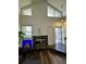 Sunlit living room features a fireplace, skylights, and an open entryway at 11576 E Bayaud Dr, Aurora, CO 80012