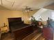 Comfortable bedroom featuring hardwood floors and ample natural light at 11576 E Bayaud Dr, Aurora, CO 80012