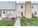 Charming townhome featuring well-maintained landscaping and a welcoming entrance at 8960 W Dartmouth Pl, Lakewood, CO 80227