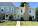 Well-manicured lawn leads to the front entrance of this lovely townhome at 8960 W Dartmouth Pl, Lakewood, CO 80227