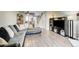 Open concept living room with wood-look floors and modern decor at 8960 W Dartmouth Pl, Lakewood, CO 80227