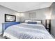 Stylish main bedroom featuring a blue dresser and decor accents, creating a cozy and inviting space at 8960 W Dartmouth Pl, Lakewood, CO 80227