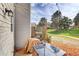 Outdoor patio with a glass-top table and string lights, perfect for relaxation and outdoor entertainment at 8960 W Dartmouth Pl, Lakewood, CO 80227