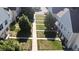 Scenic view of homes with well-kept lawns and sidewalks, enhancing the neighborhood's appeal at 8960 W Dartmouth Pl, Lakewood, CO 80227