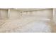 Large open basement with neutral carpeting, creating a bright and versatile living space at 17710 E Emilia Dr, Parker, CO 80134