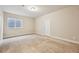 The basement room has neutral carpet, a window well, and neutral paint at 17710 E Emilia Dr, Parker, CO 80134