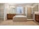 Bathroom featuring dual sinks, granite countertops, soaking tub, and glass-enclosed shower at 17710 E Emilia Dr, Parker, CO 80134