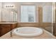 Close-up view of a soaking tub, shower, and sink in the primary bathroom at 17710 E Emilia Dr, Parker, CO 80134