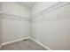 This walk-in closet features wire shelving and neutral carpeting at 17710 E Emilia Dr, Parker, CO 80134