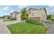 Charming single-Gathering home featuring a three-car garage, stone accents, and a well-manicured front lawn at 17710 E Emilia Dr, Parker, CO 80134