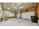 Spacious two car garage with ample storage room and a high ceiling at 17710 E Emilia Dr, Parker, CO 80134