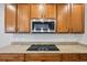 Kitchen boasting granite countertops, stainless steel appliances, and stylish wooden cabinets at 17710 E Emilia Dr, Parker, CO 80134