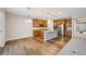 Bright eat-in kitchen featuring stainless steel appliances, a large island, and wooden floors at 17710 E Emilia Dr, Parker, CO 80134