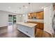 Eat-in kitchen showcasing stainless steel appliances, granite countertops, and a large island at 17710 E Emilia Dr, Parker, CO 80134