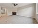 Spacious living room featuring plush carpet, a ceiling fan, and a cozy fireplace at 17710 E Emilia Dr, Parker, CO 80134