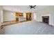 Open-concept living space with a fireplace, eat-in kitchen, stainless appliances and bright lighting at 17710 E Emilia Dr, Parker, CO 80134