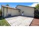 Backyard featuring a stamped concrete patio, air conditioning unit, and partial grass at 1933 Chestnut St, Fort Lupton, CO 80621