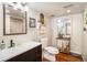Bright bathroom with modern fixtures, a vanity, and tile floor at 1933 Chestnut St, Fort Lupton, CO 80621