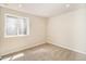 Neutral bedroom featuring window well, carpet and recessed lighting at 1933 Chestnut St, Fort Lupton, CO 80621