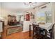 Bright breakfast nook with a view, featuring hardwood floors and a charming red door at 1933 Chestnut St, Fort Lupton, CO 80621