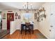 Cozy dining area with hardwood floors, a pendant light, and decorative wall art at 1933 Chestnut St, Fort Lupton, CO 80621