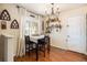 Inviting dining area with bright window, pendant lighting, and decorative wall shelves at 1933 Chestnut St, Fort Lupton, CO 80621