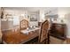 Dining room showcasing a wood table with ornate chairs and a matching buffet cabinet at 1933 Chestnut St, Fort Lupton, CO 80621