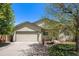 Beautiful home exterior with well manicured lawn and two car garage at 1933 Chestnut St, Fort Lupton, CO 80621