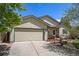 Charming one-story home with neutral siding, lush landscaping, and a two-car garage at 1933 Chestnut St, Fort Lupton, CO 80621