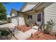 Inviting front porch with decorative planters and flower boxes enhancing the curb appeal at 1933 Chestnut St, Fort Lupton, CO 80621