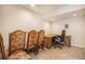 Office space features desk, chairs and carpet at 1933 Chestnut St, Fort Lupton, CO 80621