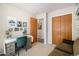 Functional office space with a desk, chair, and ample closet storage at 1933 Chestnut St, Fort Lupton, CO 80621